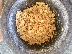 The Mat Movement luxury yoga retreats; peanuts in a pestle and mortar.